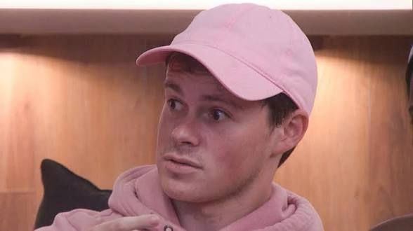 Cory wearing a pink hat bb25