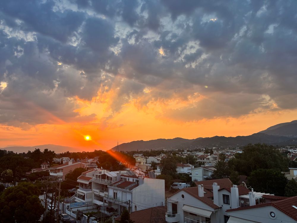 Sun rise over houses in Patras, Greece