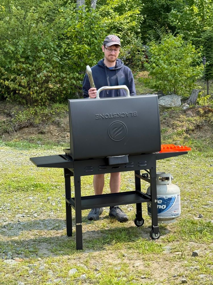 User’s partner pretending to be comfortable using a grill