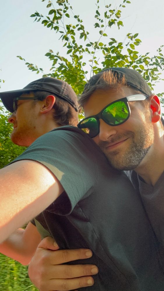 User holding onto his partner on the back of a four wheeler