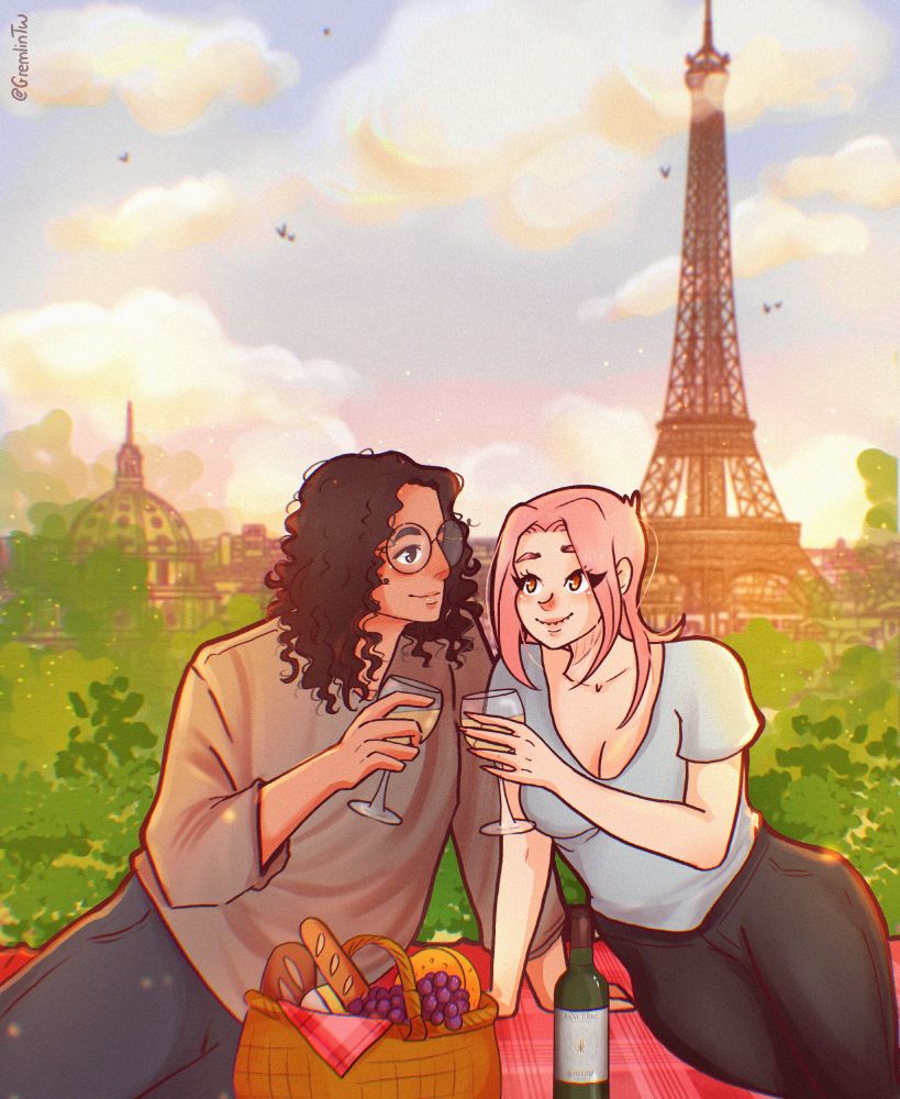 Billy and Gremmy enjoying a picnic. They're smiling at each other, wine glasses in hand. You can the Eiffel Tower in the background.