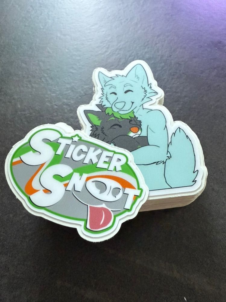 Some recently cut stickers for ElectroFolf! Our Sticker Snoot logo sticker (on the top of the stack) is themed differently for every customer!