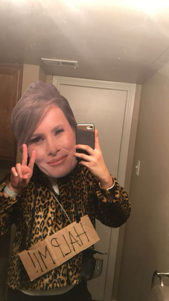 Melania holding the peace sign. 