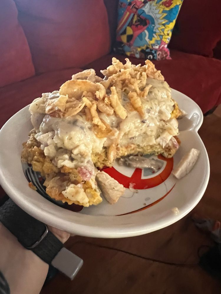 Side view of the Thanksgiving waffle stack with several forkfuls removed/eaten, revealing the BB-8 plate underneath it/