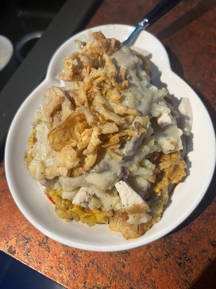 The BB-8 stuffing waffle with additional leftovers stacked on top, plus mornay sauce and French fried onions.