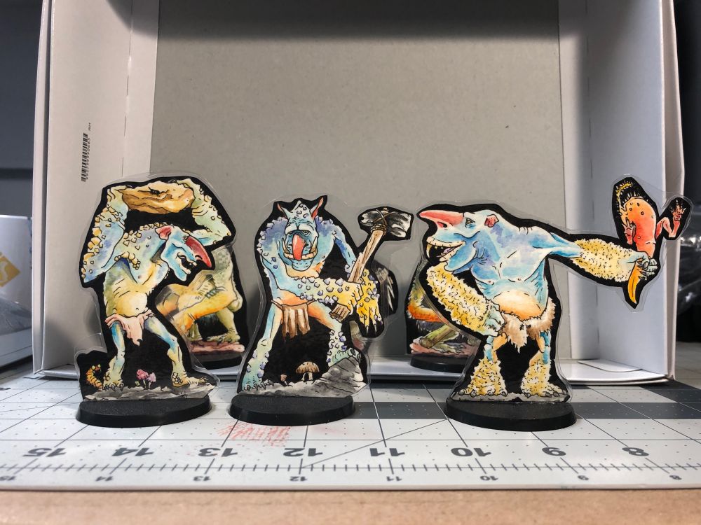 Three rock trolls. Calcified, blue skinned and happy to hurl boulders.