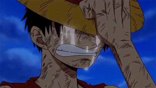 a man in a straw hat is crying with a tear coming out of his eyes