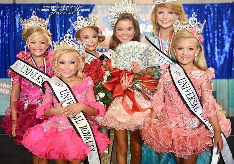 A group of weird looking US beauty pageant winners with sashes. 