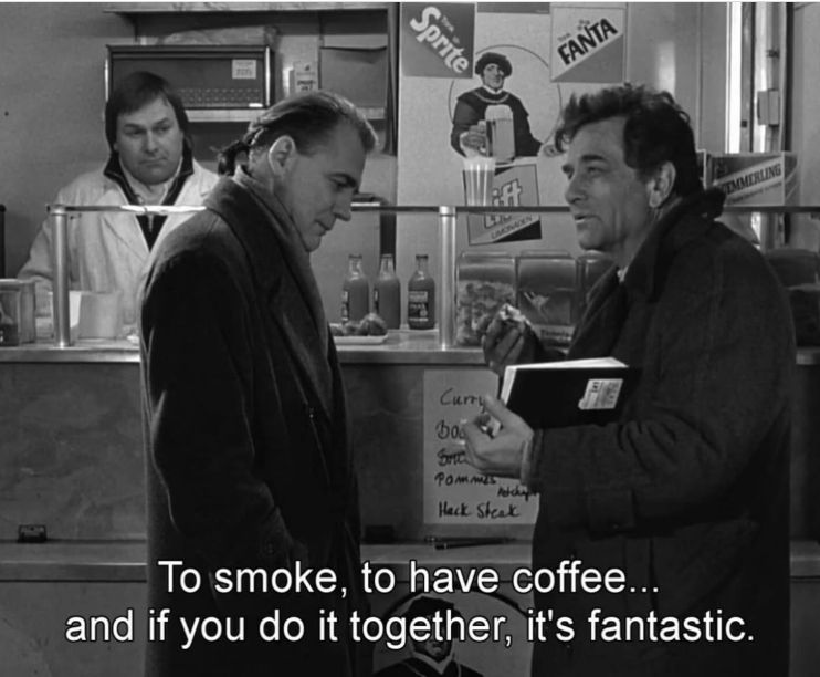 Peter Falk and Bruno Ganz in Wings of Desire, with the caption of Falk saying, "To smoke, to have coffee...and if you do it together, it's fantastic."
