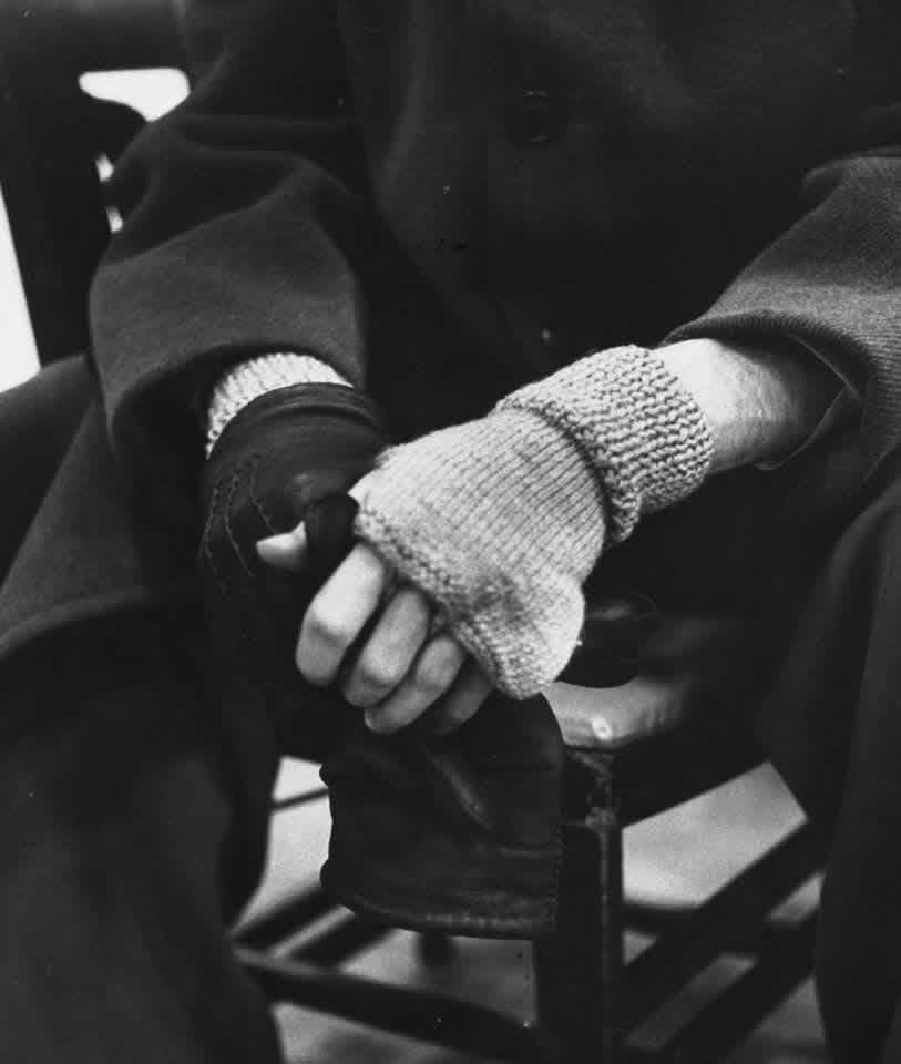 The hands of pianist Glenn Gould. He’s wearing fingerless wool gloves. 
