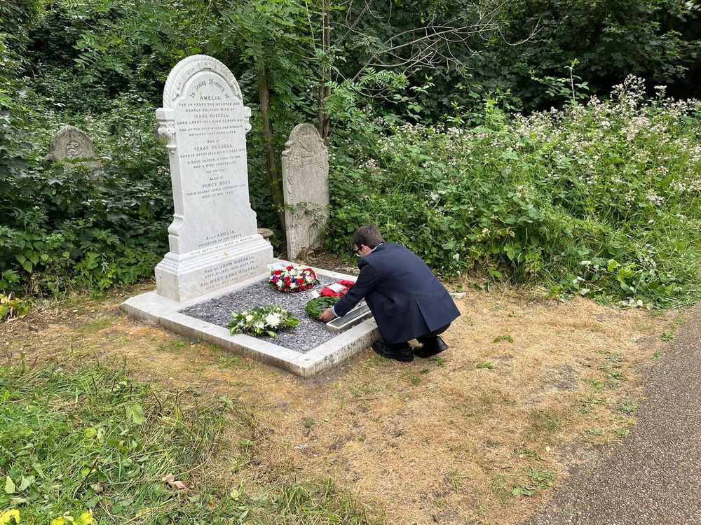 Then Chair of the Napoleonic & Revolutionary War Graves Charity Dr Zack White laying a wreath on behalf of the organisation at the newly renovated grave of Guardsman John Russel who fought at Hougoumont Farm during the Battle of Waterloo on 18th June 1815