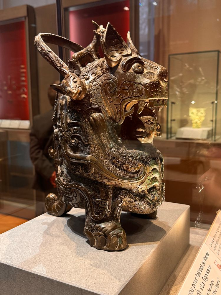 I’ve seen pictures of this one in many books! A bronze tiger who’s being hugged/or is eating a person. 