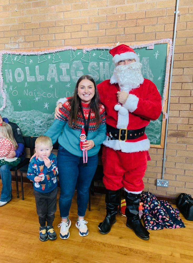 Christmas party at Naíscoil na Seolta. Dadaí na Nollaig with our Naíscoil leader and one of the children. 