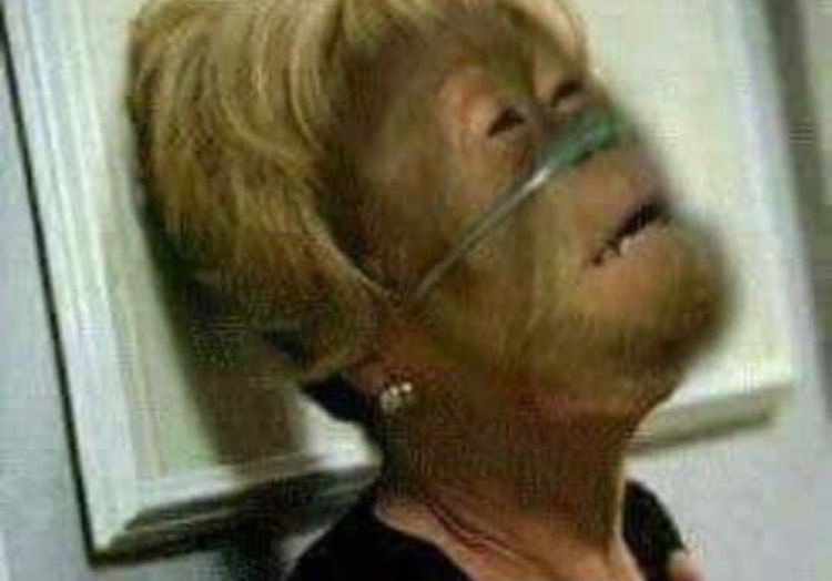 A chimp in a blonde wig wearing an oxygen plug in their nose, throws their head back and is clearly letting out the biggest weary sigh, because what you mean the baby was a surprise??????