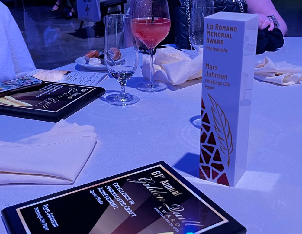 A Golden Quill plaque and an acrylic jersey with inset clear red pieces engraved Ed Romano Memorial Award Photography: Mars Johnson Pittsburgh City Paper