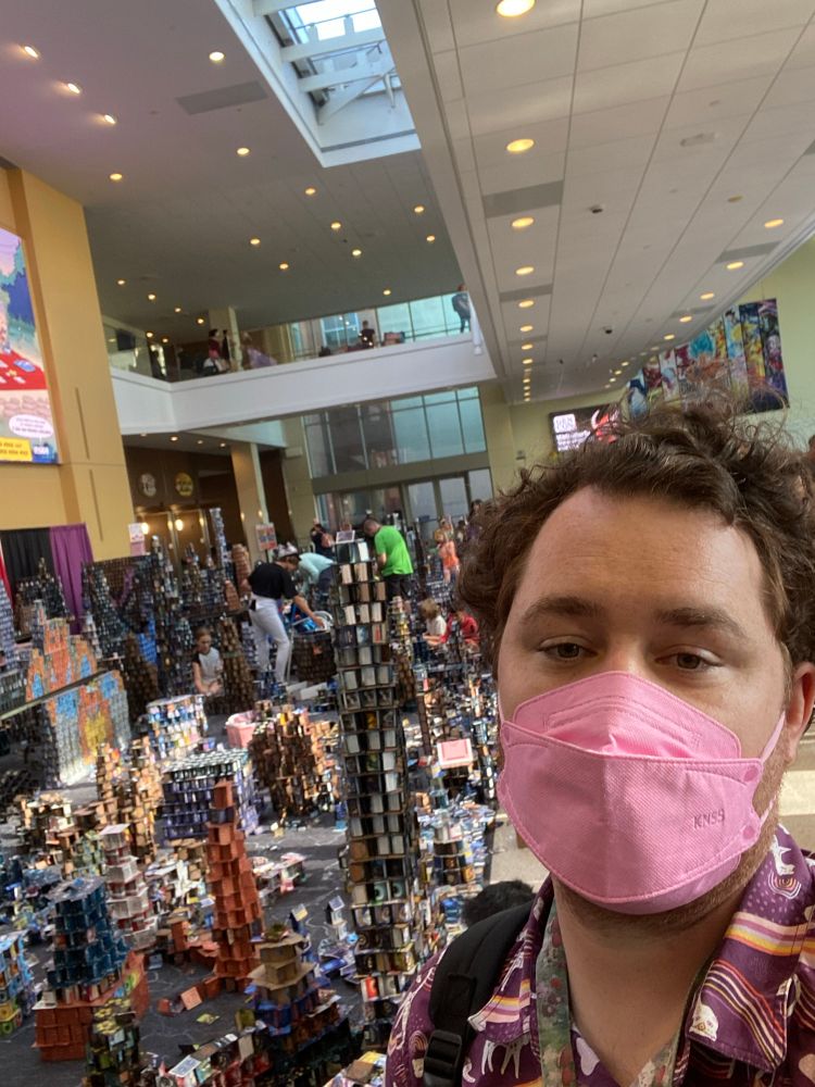 Me with a truly prodigious number of stacked card towers behind me