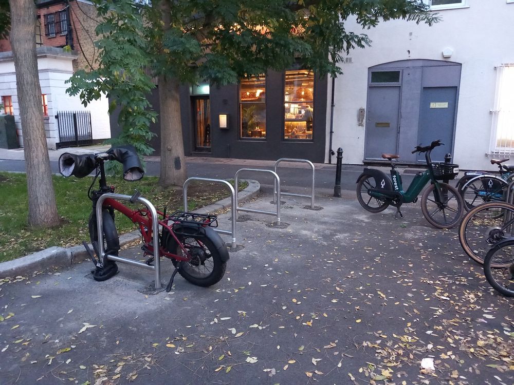 4 new stainless steel bike stands with tapping bars. To the left of the Guildhall as you look at it. 