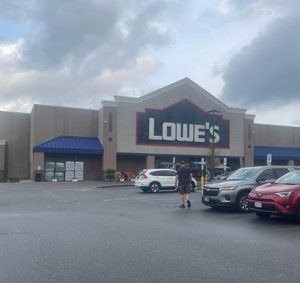 Photo of a Lowe’s at dusk on a partially cloudy day.