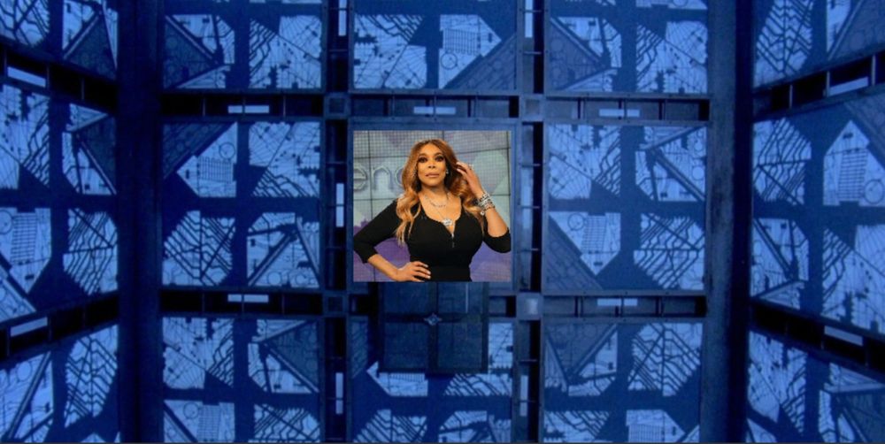 Wendy Williams in The Cube (1997).  She is in one of the open center-square doors