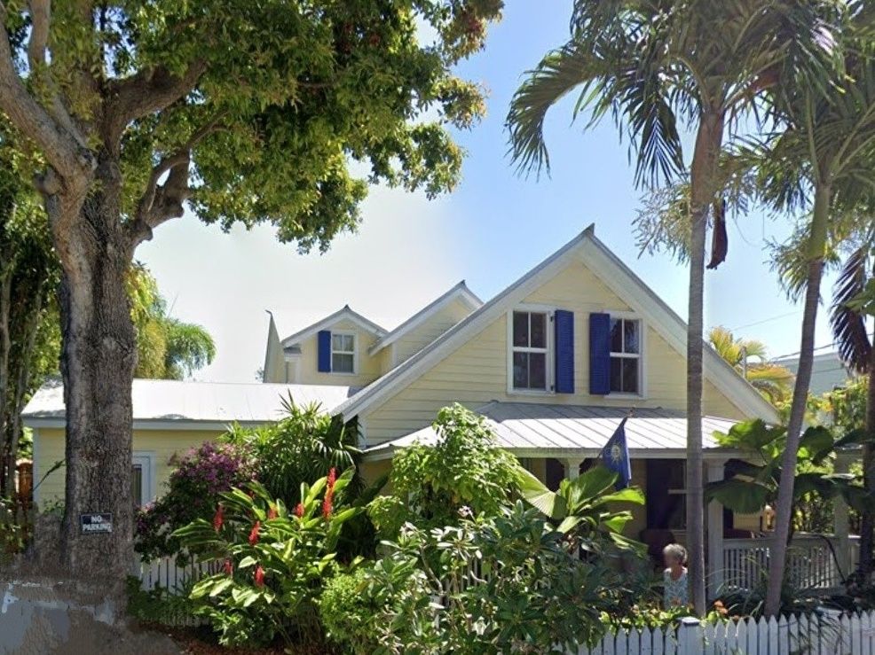 Taken down to exterior walls, enlarged under strict historic district oversight and planted. 