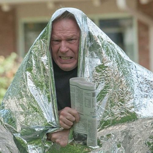 Michael McLean as chuck McGill in better call Saul, he is wearing a foil blanket