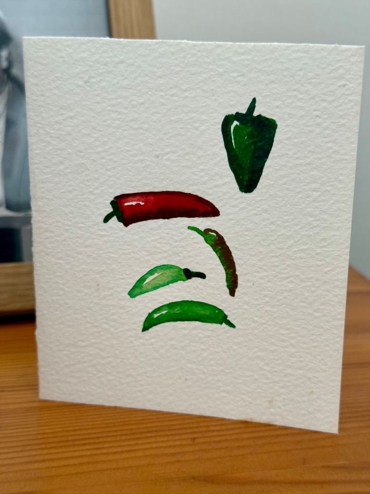 Greetings card with watercolour painting of assorted chillies. 