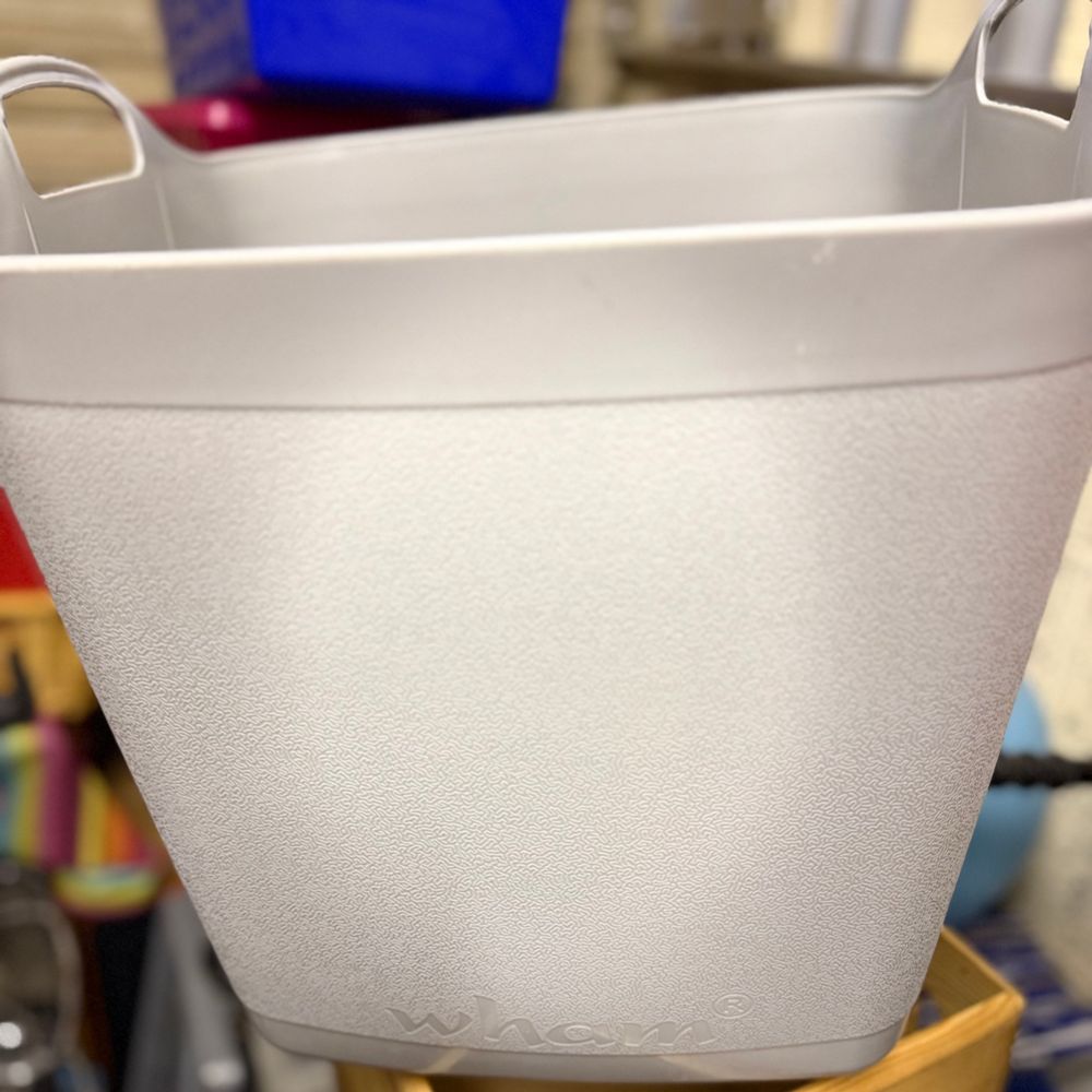 A big, square, grey bucket, with the brand name “wham” embossed near the bottom. 