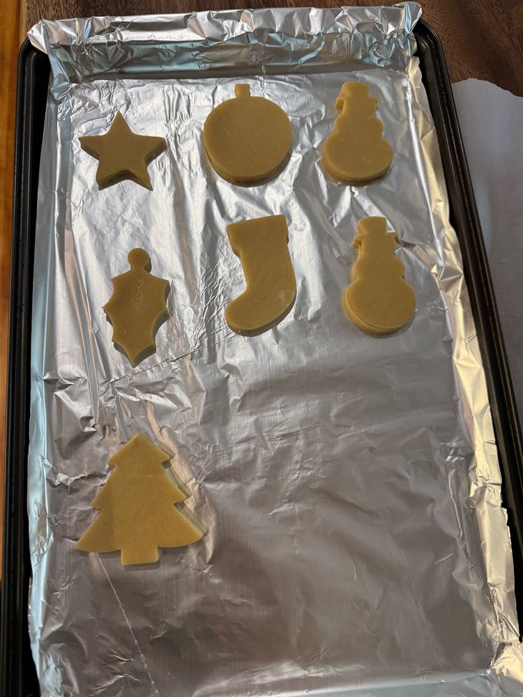 Christmas cookies on a baking tray ready to go in the oven