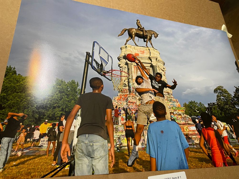 20x30 photo print taken in the summer of 2020 with a group of black kids playing a pickup basketball in front of an appropriately defaced confederate statue
