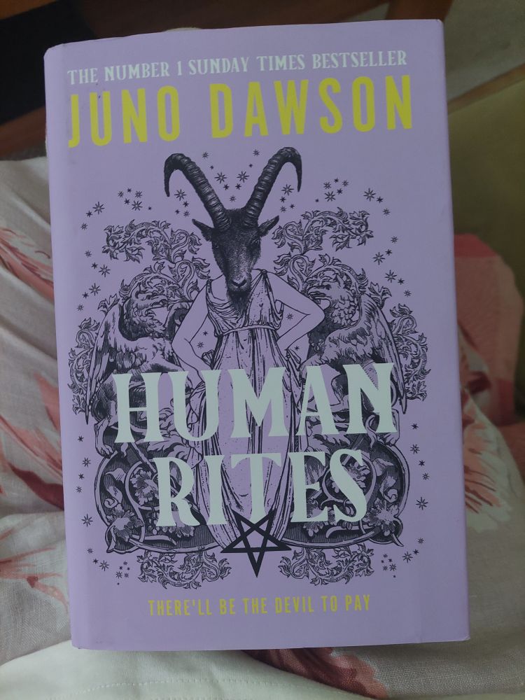 Lila Cover mit Zeichnung einer Frau mit Ziegenkopf und Titel "Human Rites" 