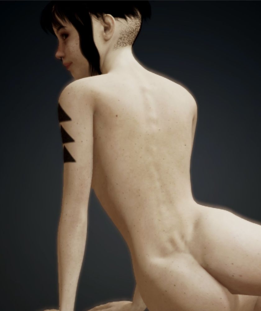 a young brunette woman posing with her chest uncovered, slightly smiling