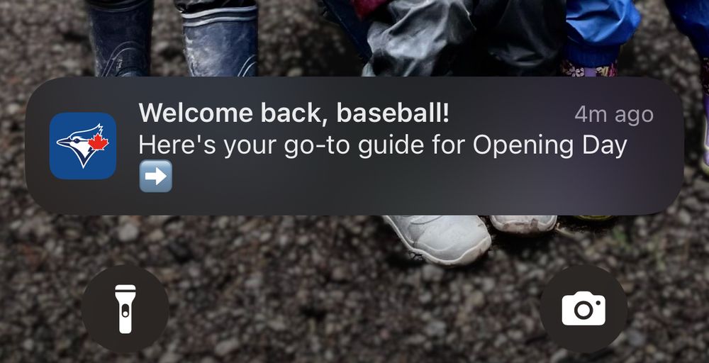A phone notification from MLB that reads “Welcome back, baseball! Here’s your go-to guide for Opening Day”