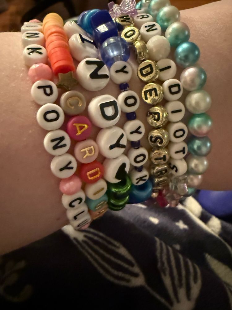 My wrist with friendship bracelets on it