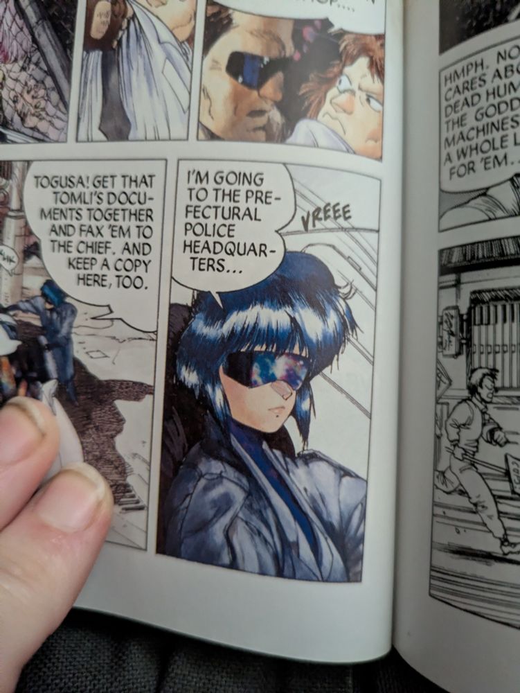 Major from page 116 of the GITS manga, with a subtle shine from lip gloss visible between the part of her lips and the lower edge pursed on her chin.