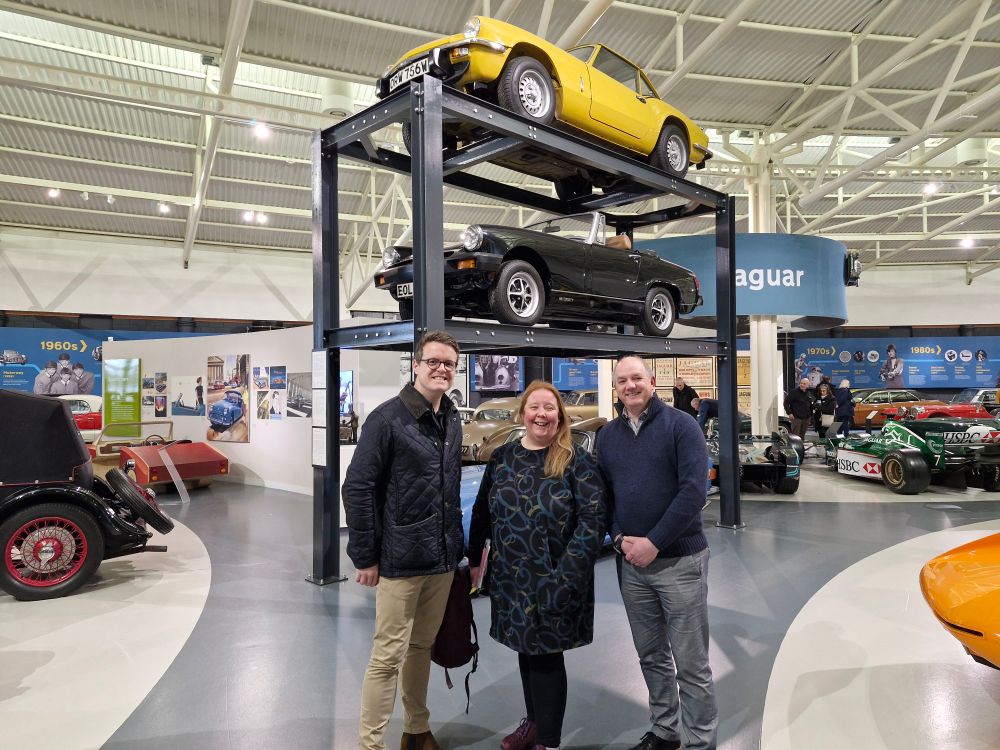 Photo of Chris Cowcher, WRCC along with Stephen Laing and Emma Rawlinson from the British Motor Museum, amongst exhibits at the Gaydon based museum site.