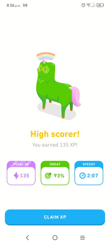 A phone screenshot of the Duolingo app featuring a green unicorn with a creepy owl face. 