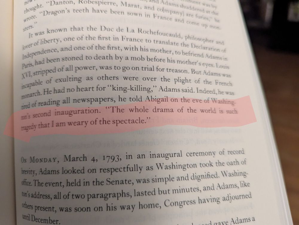 A page from the book John Adams by David McCullough. Highlighted is a quote from Adams. "The whole drama of the world is such tragedy than I am weary of the spectacle."