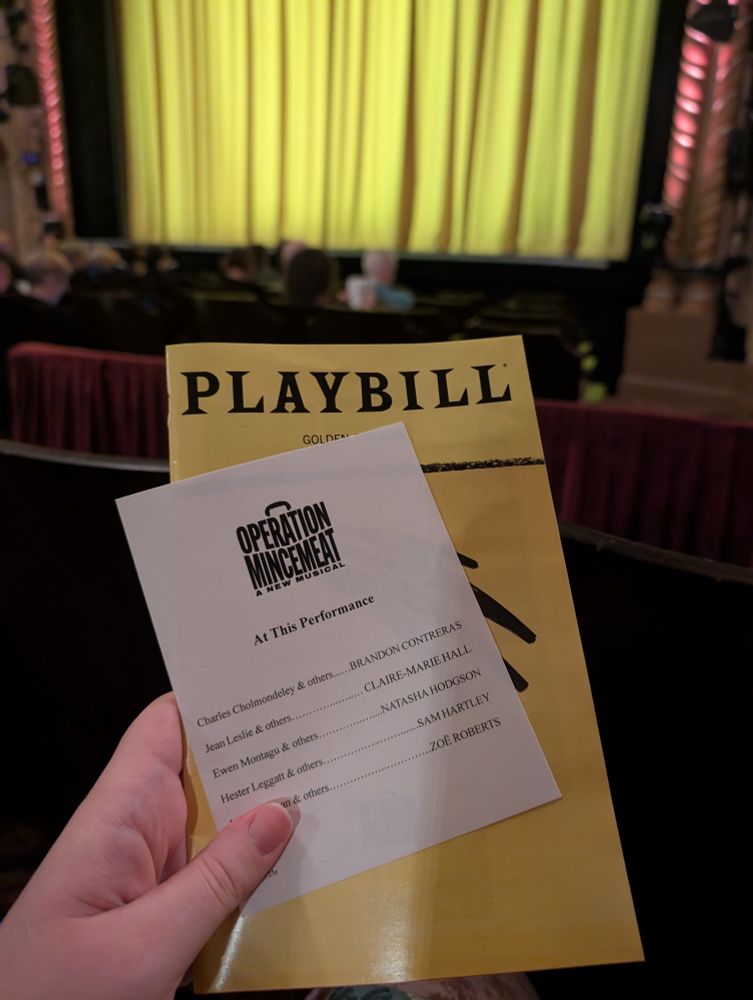 A Playbill and understudy noticed from Operation Mincemeat, framed against a yellow curtain