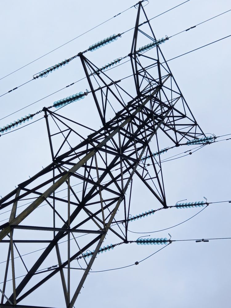 Electricity pylon under a grey sky. 