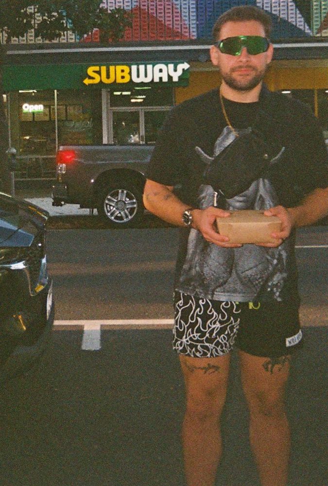 Chef next to a Subway sign