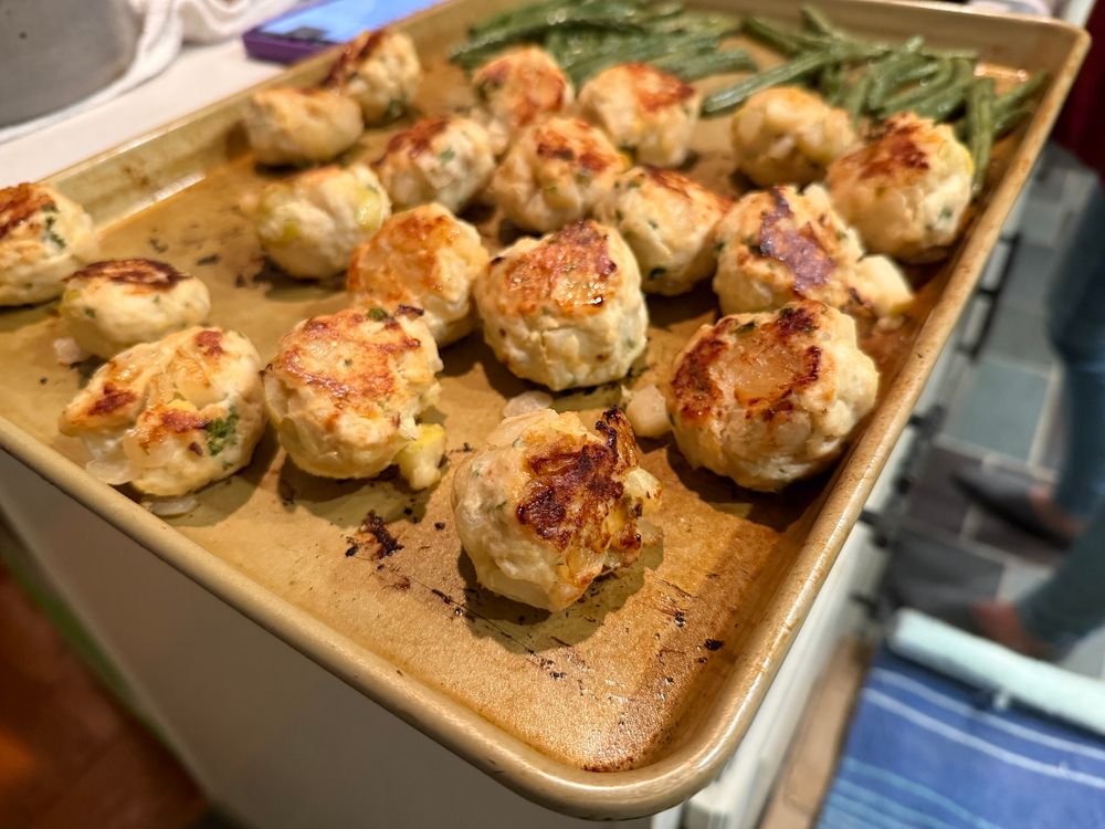 A sheet pan of chicken meatballs and roasted green beans