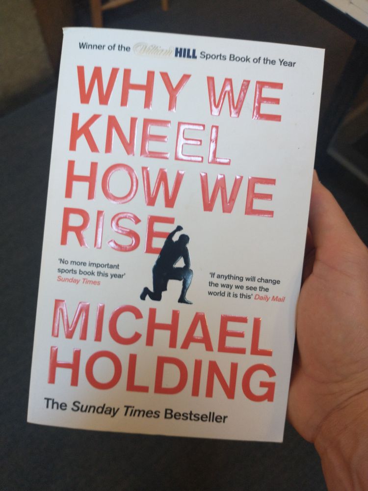 Paperback of the book Why We Kneel, How We Rise by Michael Holding. 