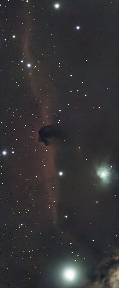 This is the Horsehead Nebula (IC 434). This is an emission nebula which means that a horsehead-shaped gas cloud is blocking light from behind so it looks like the head of a horse. Two big stars from the Orion constellation are featured at the middle-right and bottom of the photo. The nebula is a red colour and is about 1200 light years from the Sun.