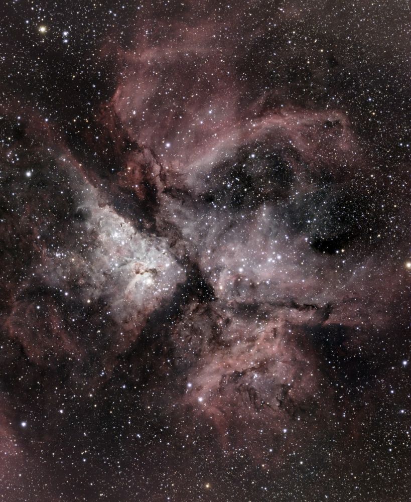 The Carina Nebula consists of three major parts that look a bit like a pinwheel. The top 'wedge' is a reddish plate of dust with what looks like a dinosaur head of slightly brighter dust on the side. The bottom right 'wedge' is still mainly red but consist of two pieces, the top of which looks a bit like a crocodile head with teeth and the bottom is just a rectangula blob of dust. The middle left 'wedge' is the brightest and most spectacular part. It is triangular in shape and the central part of the triangle is very bright with lots of stars. There are lots of stars throughout the image. It is hard to describe but I hope I did it some justice.