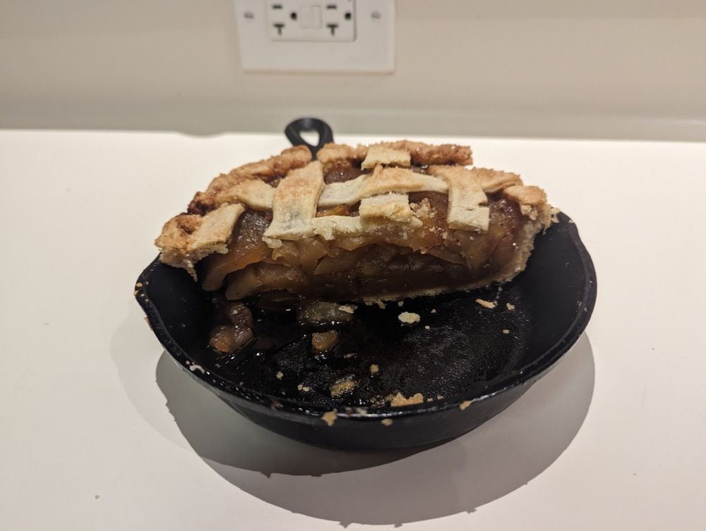 Previous pie cut in half, holding it's shape without spilling out