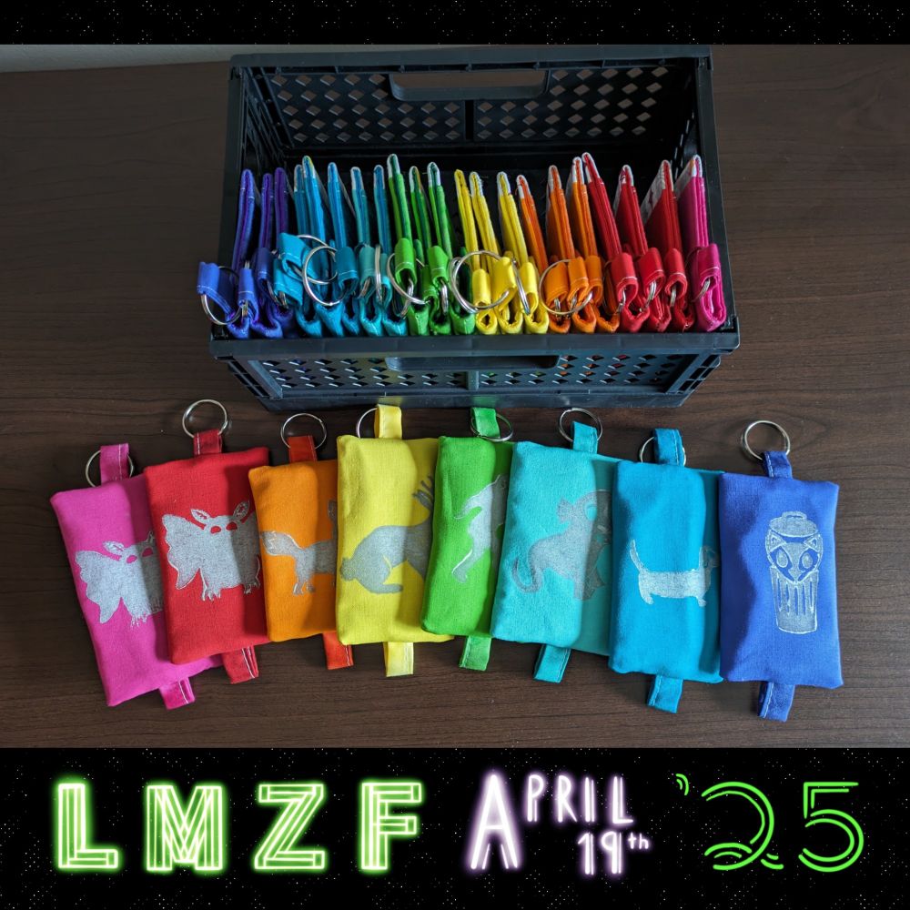 A bunch of pouches woth prints on them in a wide assortment of colors!