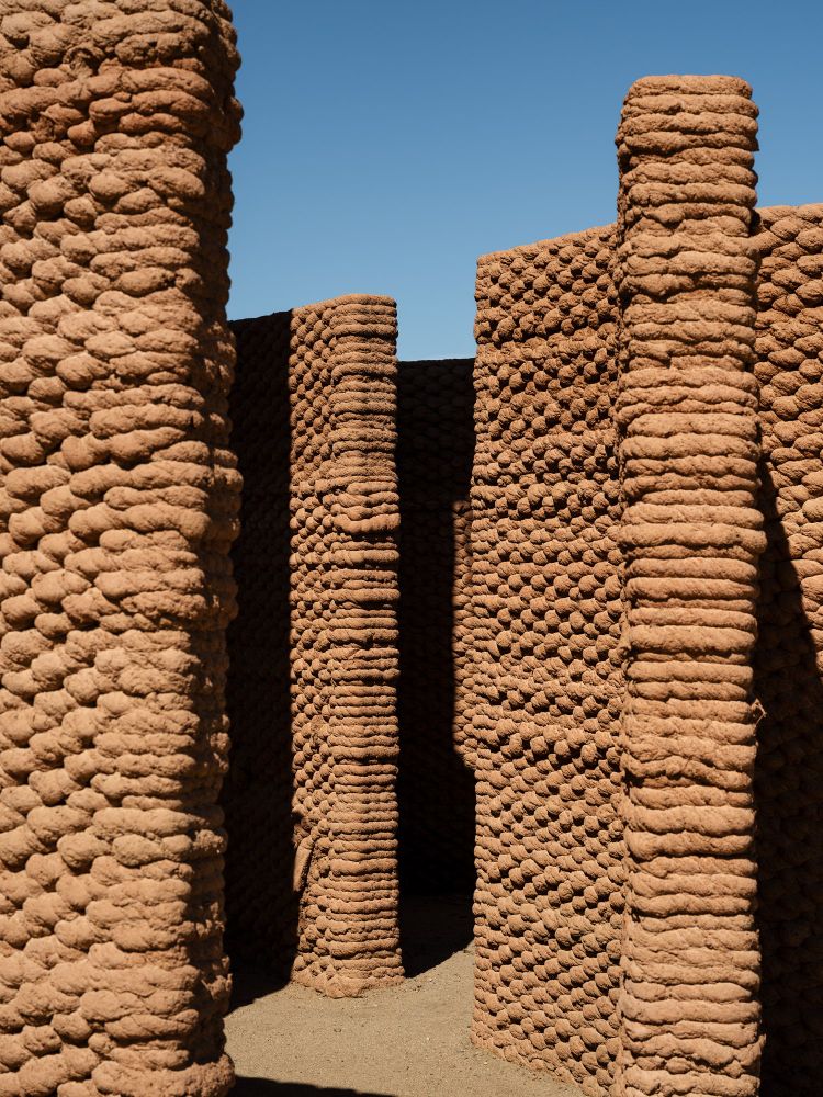 Photo of a 3D printed adobe architectural installation in Palm Springs by the artist Ron Rael. 