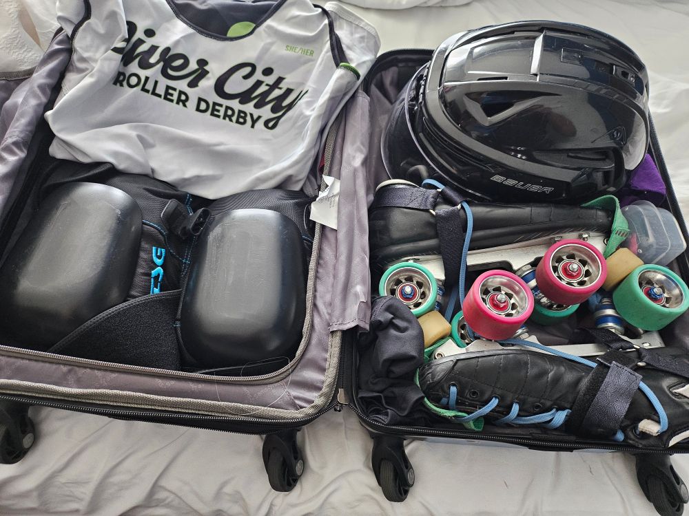 Roller Derby gear packed in a carry on luggage suitcase