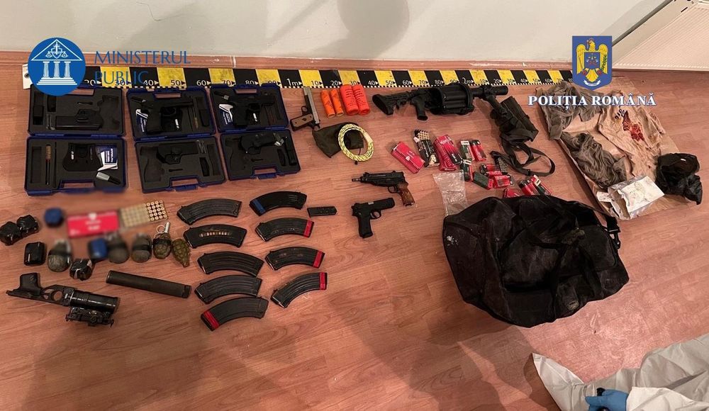 Illegal weapons cache sprawled on floor