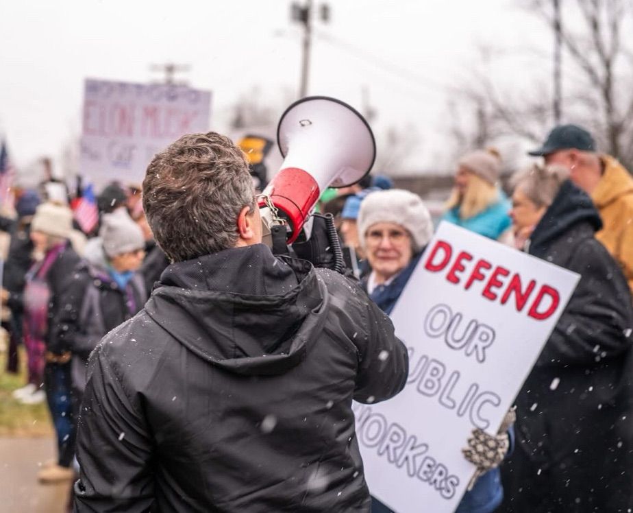 Man on megaphone at protest